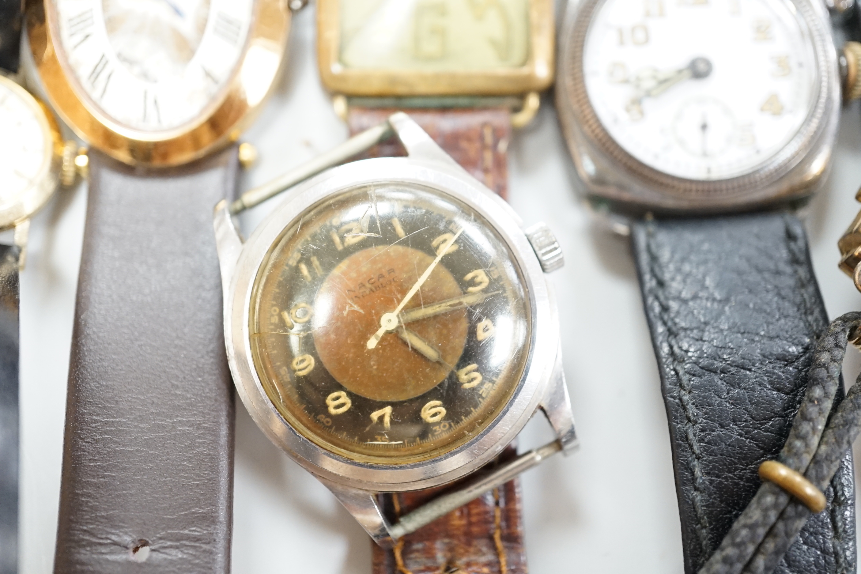 Five gentleman's assorted wrist watches including Swatch and early 20th century white metal and two lady's wrist watches.